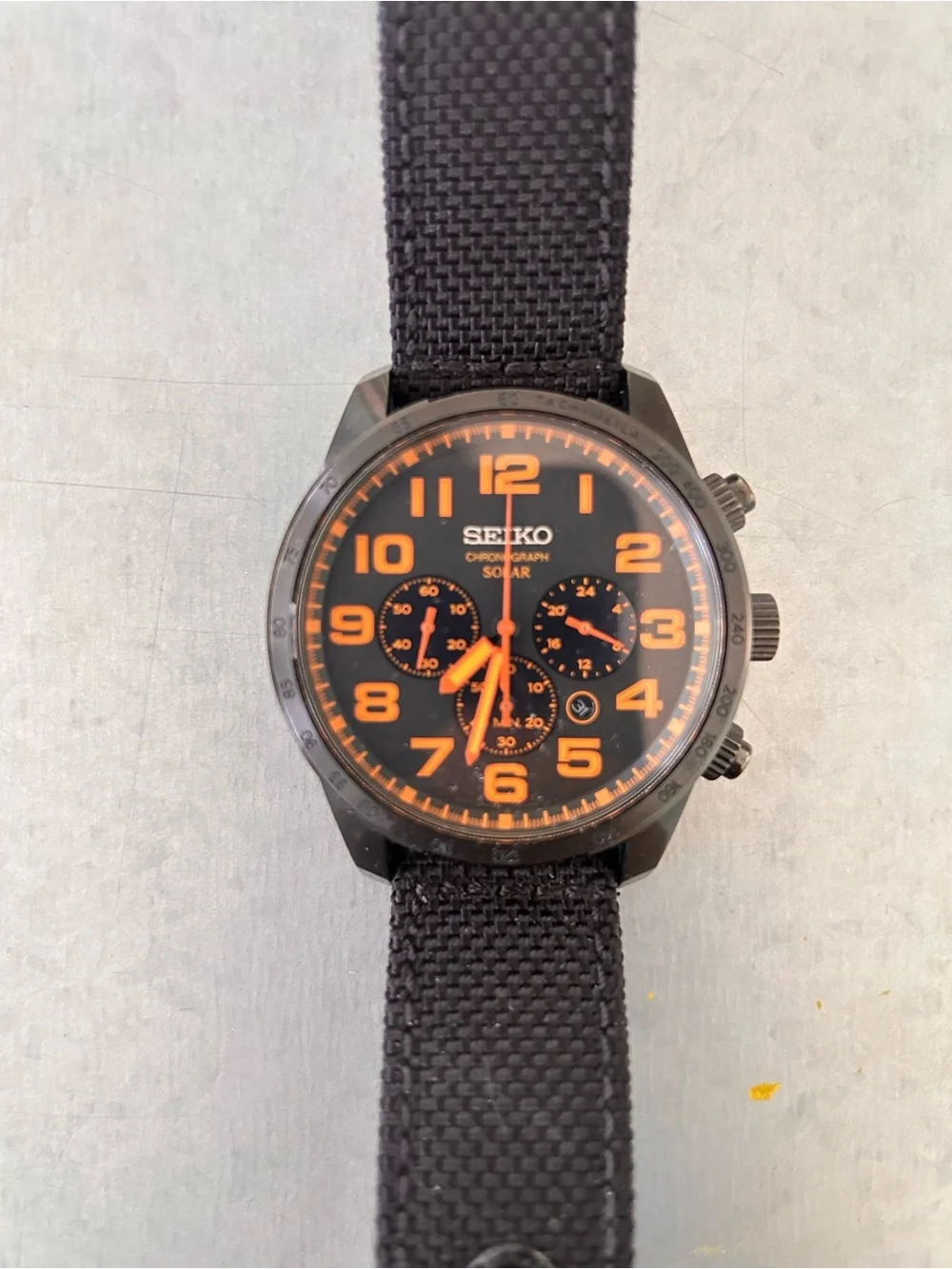 Seiko Men's Black Strap Watch with Orange Accents